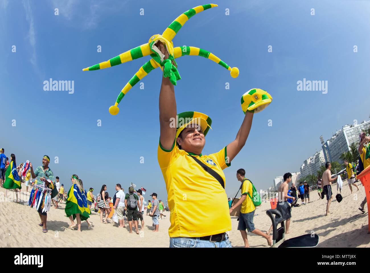 Copacabana, Rio de Janeiro - June 28, 2014: During the World Cup street vendors sell souvenirs in green and yellow, the national colours of Brazil Stock Photo