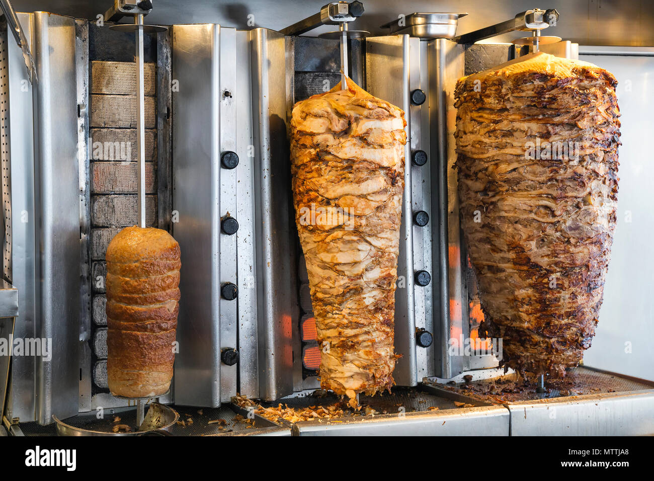 Greek gyros shop, stacked meat roasting. Greek national fast food, traditional  Greek cuisine, grilled meat for gyros souvlaki. Vintage style Stock Photo -  Alamy