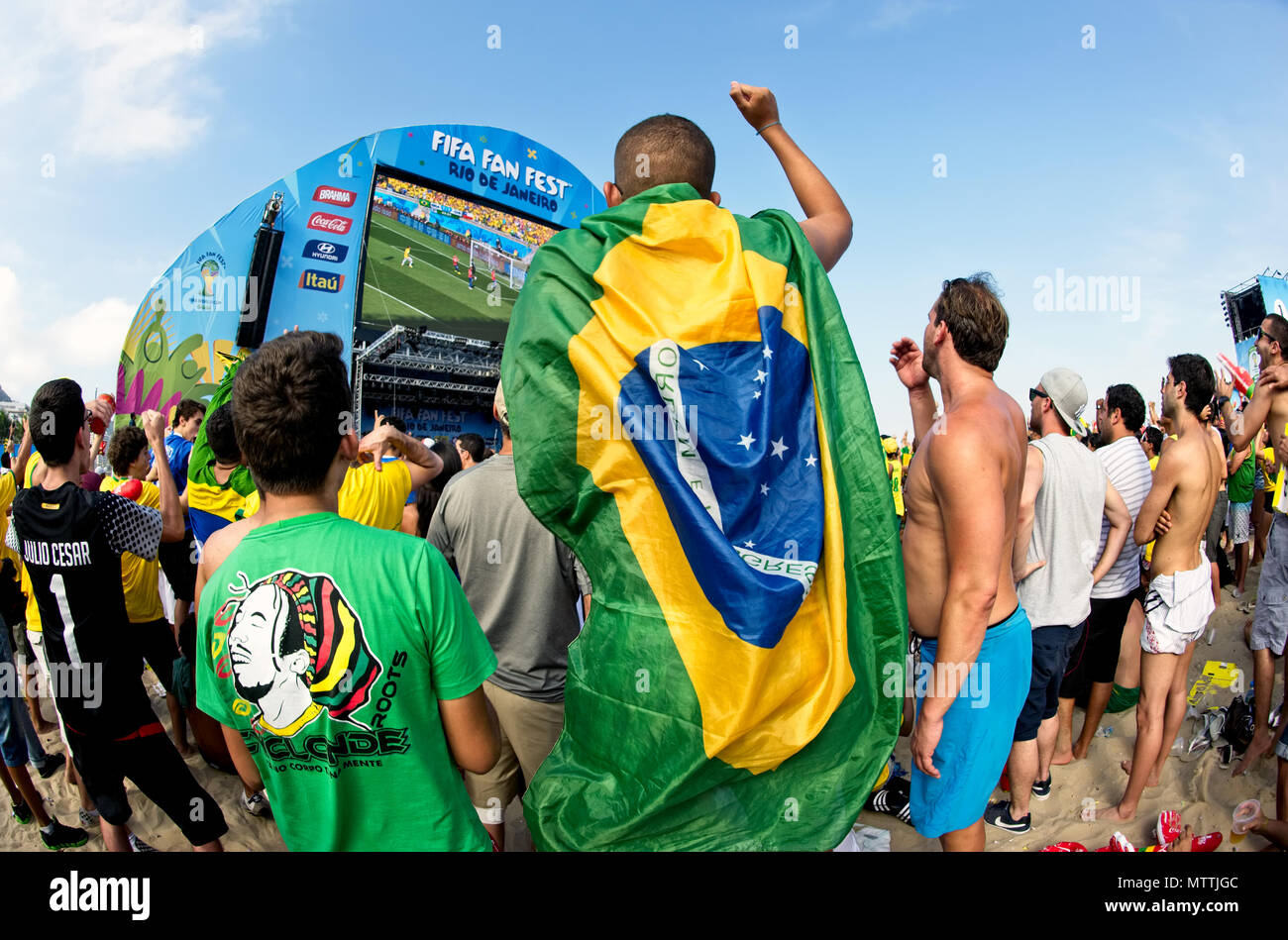 World Cup, Rio de Janeiro, Brazil - June 28, 2014: Brazilian soccer fans support their soccer team at the Fifa Fan Fest area on Copacabana beach Stock Photo