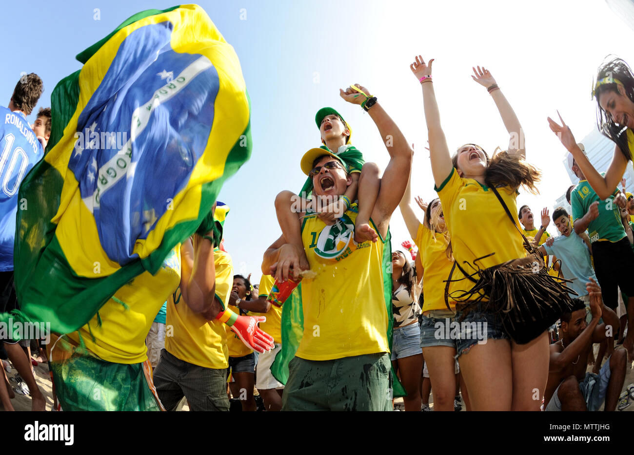 World Cup 2014, Rio de Janeiro - June 28: Brazilian supporters celebrate at the Fifa Fan Fest during the Brazil - Chile match. Brazil win on penalties Stock Photo
