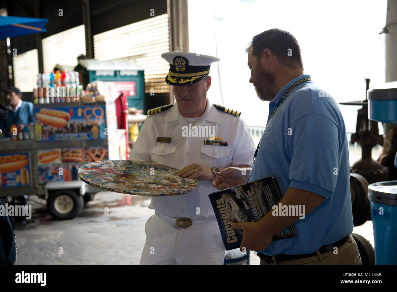 180527-N-IT235-0052 NEW YORK (May 27, 2018) Michael Jones, the environmental resources and planning section head for U.S. Fleet Forces Command’s Fleet Environmental and Readiness Division, explains the shipboard waste process to reduce plastic waste aboard ships at the U.S. Navy’s “Stewards of the Sea: Defending Freedom, Protecting the Environment” exhibit during Fleet Week New York. The Navy employs every means available to mitigate the potential environmental effects of our activities without jeopardizing the safety of our Sailors or impacting our Navy readiness mission. (U.S. Navy photo by  Stock Photo