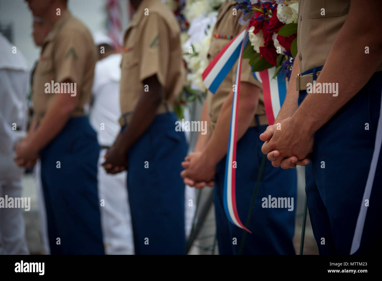 U.S. Marine Corps Lance Cpl. Jarod Bernosky, right, with Special Purpose  Marine Air-Ground Task Force Fleet Week New York stands at modified parade  rest during the Intrepid Memorial Day Commemoration at Intrepid