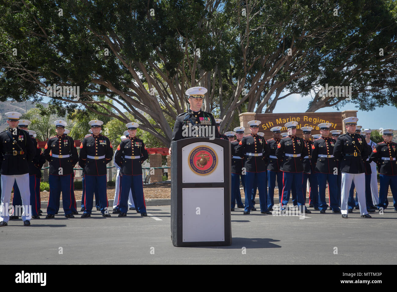 U.S. Marine Corps Lt. Col. John Gianopoulos, the commanding officer of 5th Marine Regiment, 1st Marine Division, speaks during the 5th Marines Vietnam War Memorial unveiling ceremony in the Camp San Mateo Memorial Garden at Marine Corps Base Camp Pendleton, Calif., May 28, 2018. The memorial is inscribed with the names of 2,706 Marines and sailors who gave their lives serving our great nation. (U.S. photo by Lance Cpl. Rhita Daniel) Stock Photo