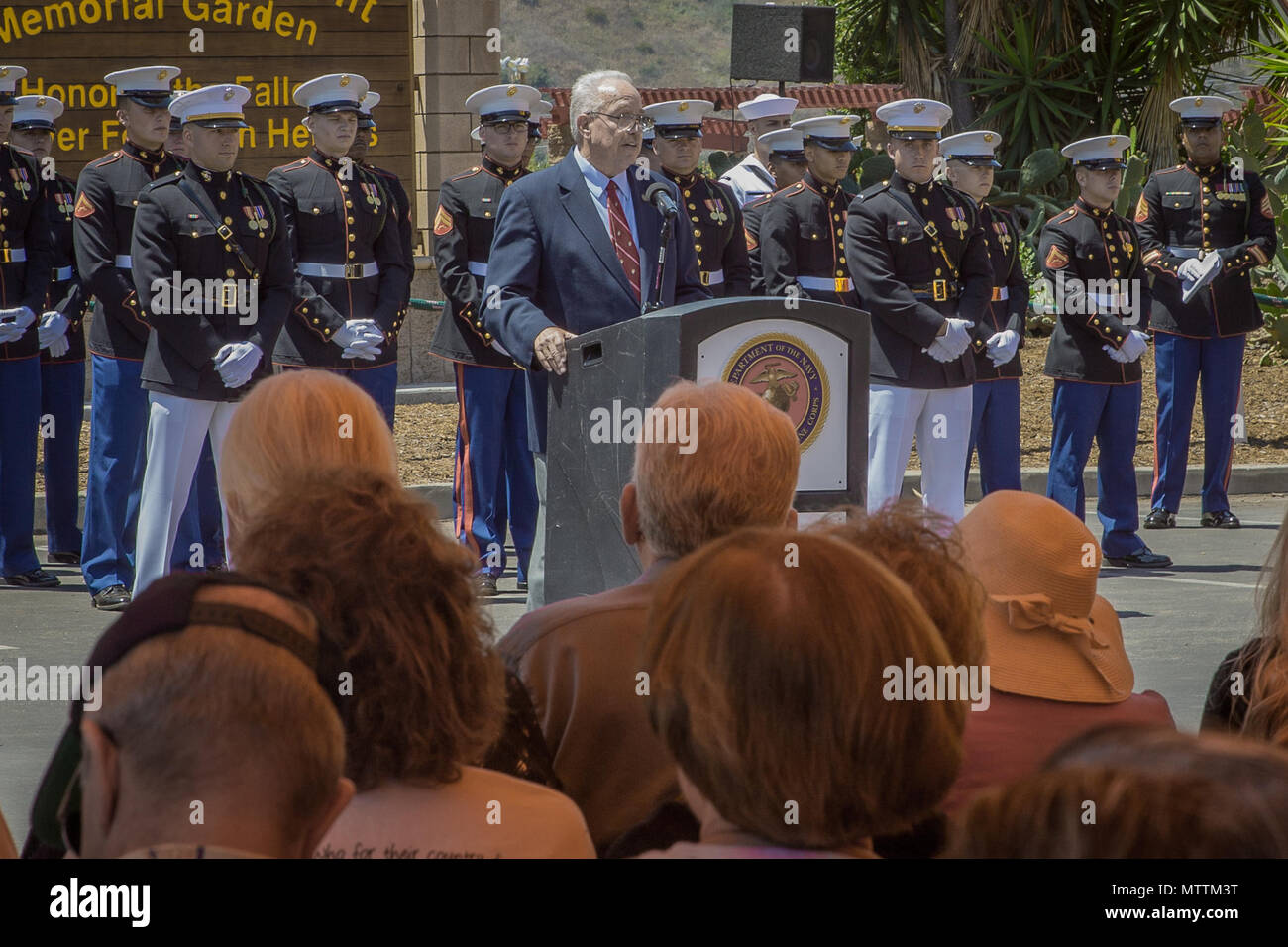 Nick Warr, a  U.S. Marine Corps veteran, speaks during the 5th Marines Vietnam War Memorial unveiling ceremony in the Camp San Mateo Memorial Garden at Marine Corps Base Camp Pendleton, Calif., May 28, 2018. The memorial is inscribed with the names of 2,706 Marines and sailors who gave their lives serving our great nation. (U.S. photo by Lance Cpl. Rhita Daniel) Stock Photo