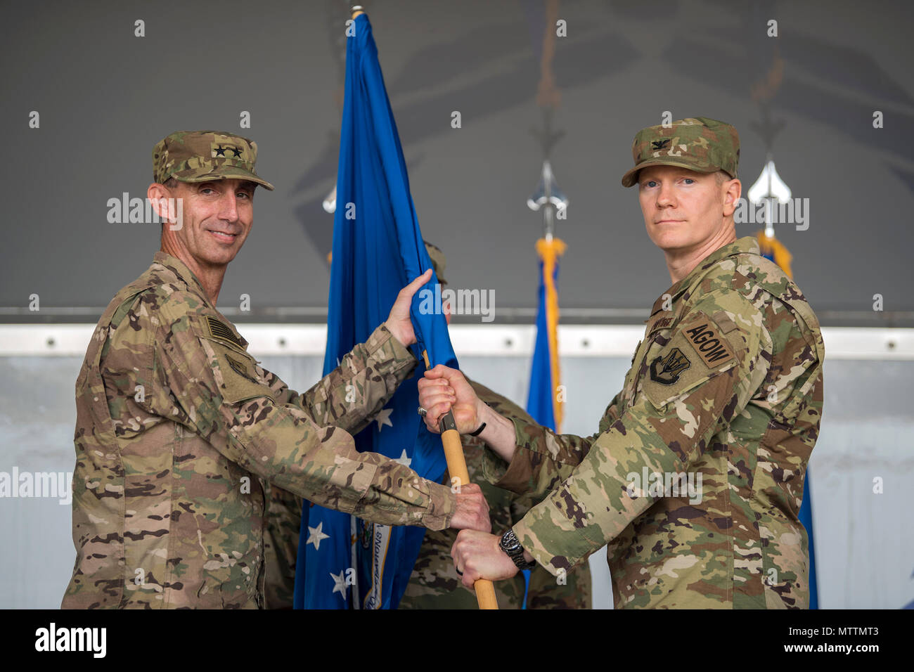 Maj. General Scott Zobrist, left, 9th Air Force Commander, hands the guidon to Col. Paul Birch, incoming 93d Air Ground Operations Wing (AGOW) commander, during a change of command ceremony, May 23, 2018, at Moody Air Force Base, Ga. This event marks the beginning of a new regime as Birch becomes the 7th commander of the 93d AGOW. (U.S. Air Force photo by Airman 1st Class Eugene Oliver) Stock Photo
