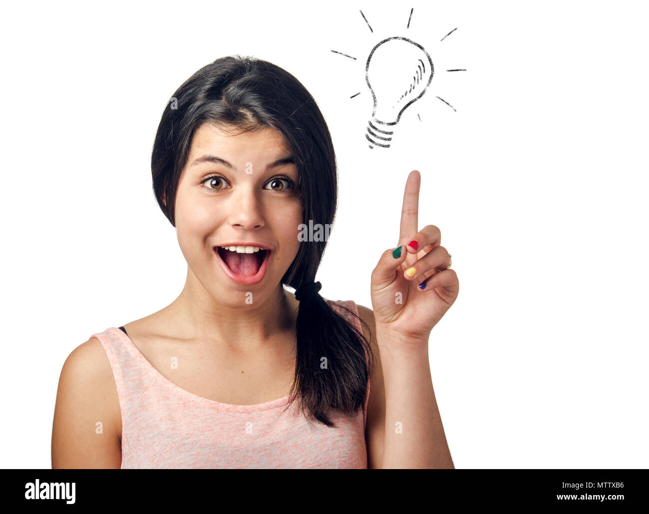 Beautiful brunette teenager having a bright idea pointing her finger up Stock Photo