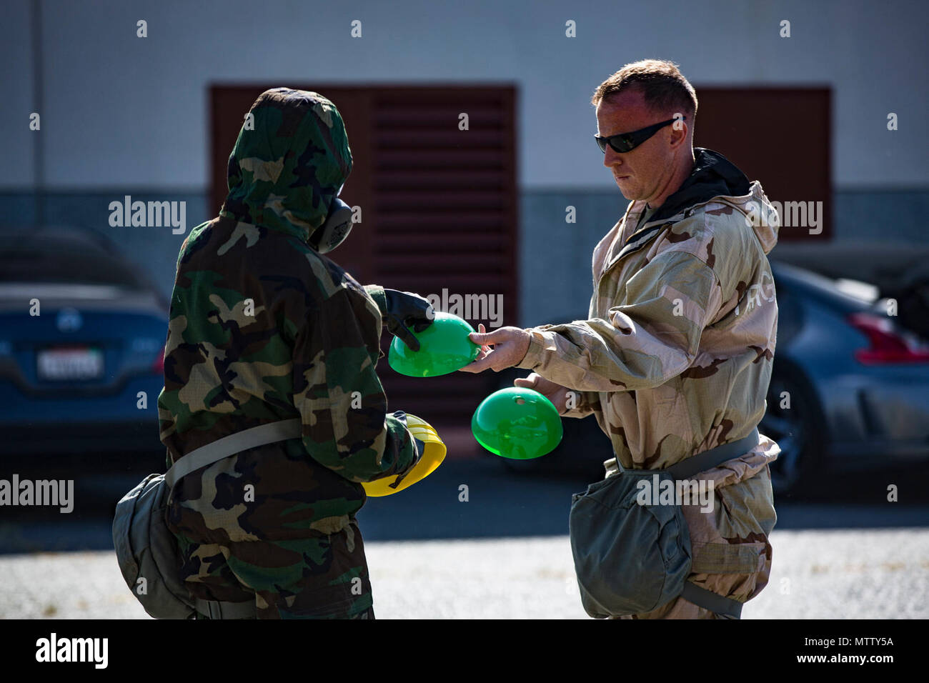 U.S. Marine Staff Sgt. Philip Barnes hands out cones to conduct Reconnaissance, Surveillance and Decontamination Training aboard Marine Corps Base Camp Pendleton, Calif., April 26, 2017. The cones serve as simulated threats and hazards in a chemical, biological, radiological and nuclear environment. The purpose of this training is to accomplish missions within CBRN environment.  Barnes is the current CBRN Chief for 1st Maintenance Battalion, 1st Marine Logistics Group. Stock Photo
