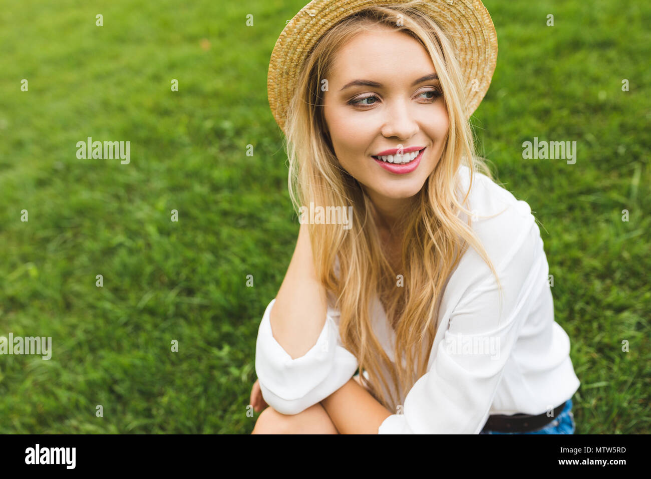 portrait of beautiful smiling woman in straw hat looking away Stock ...