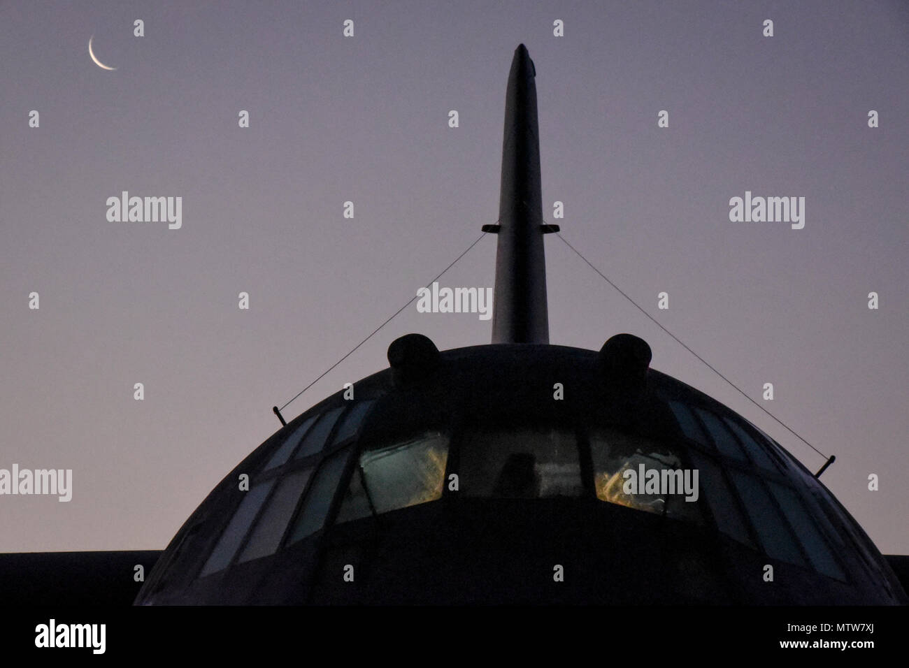 A C-130H Hercules is prepared for daily flight operations on the flightline in the early morning of Jan. 25, 2017, at the 179th Airlift Wing, Mansfield, Ohio. The 179th Airlift Wing is always on a mission to be the first choice to respond to community, state and federal missions with a trusted team of highly qualified Airmen. (U.S. Air National Guard photo by 1st. Lt. Paul Stennett/Released) Stock Photo