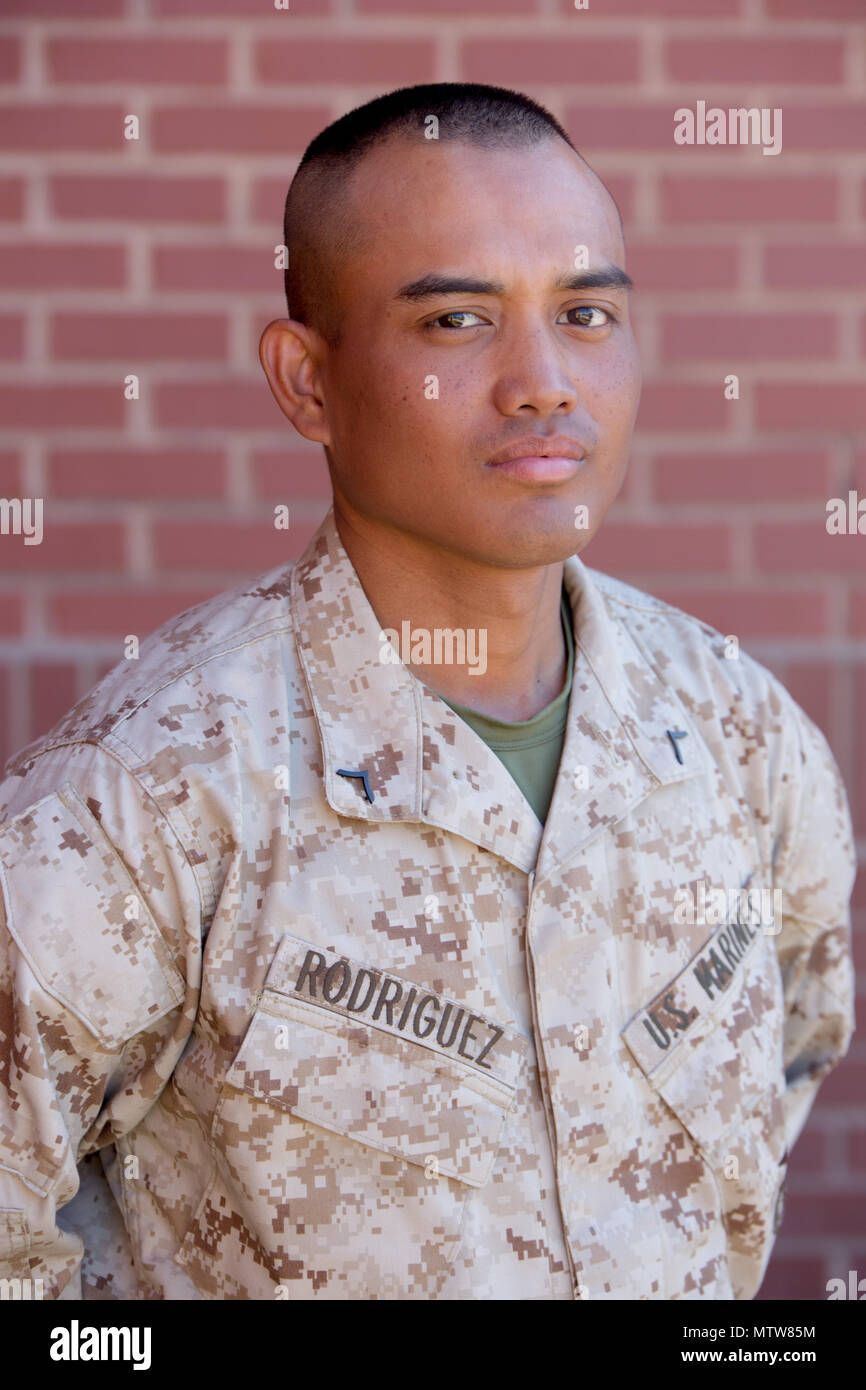 Pfc. Christopher Rodriguez, Platoon 1005, Charlie Company, 1st Recruit Training Battalion, earned U.S. citizenship Jan. 26, 2017, on Parris Island, S.C. Before earning citizenship, applicants must demonstrate knowledge of the English language and American government, show good moral character and take the Oath of Allegiance to the U.S. Constitution. Rodriguez, from Owensboro, Ky., originally from Micronesia, is scheduled to graduate Jan. 27, 2017. (Photo by Lance Cpl. Maximiliano Bavastro) Stock Photo