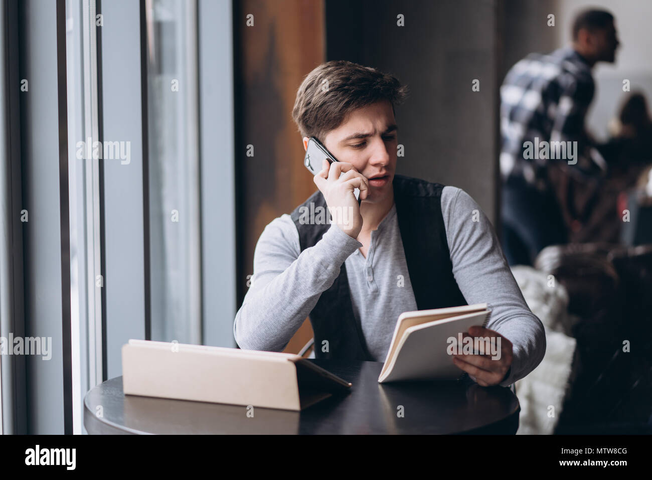 Young man with tablet pc computer at cafe Stock Photo