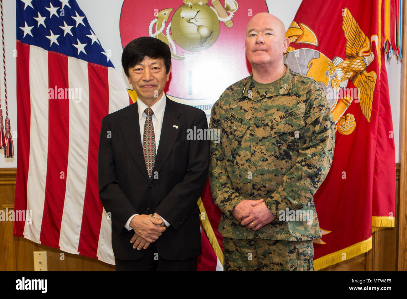 U.S. Marine Corps Maj. Gen. Walter L. Miller Jr., commanding general, II Marine Expeditionary Force (II MEF), poses for a photo with Consul General for Japan Takashi Shinozuka during a visit to Camp Lejeune, N.C., Jan. 20, 2017. The purpose of the visit was to provide Consul General Shinozuka an opportunity to meet with senior leadership of II MEF as well as a familiarization overview of the MV-22 Osprey training syllabus that Japanese pilots are undergoing at Marine Corps Air Station New River. (U.S. Marine Corps photo by Cpl. Abraham Lopez) Stock Photo