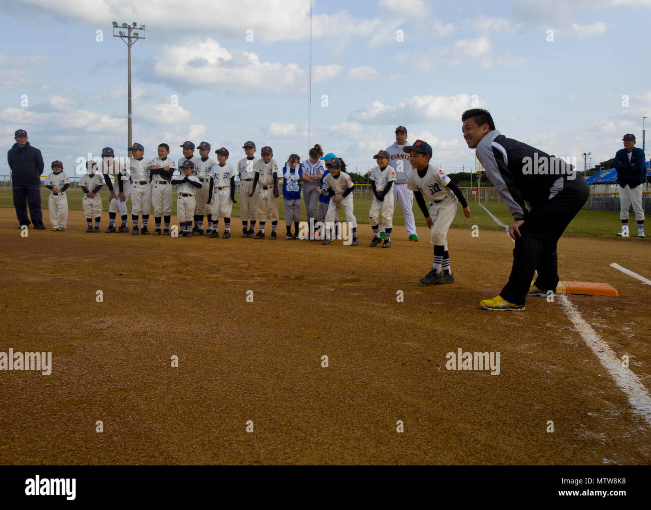 CAMP FOSTER, Okinawa, Japan – A child practices batting at a youth baseball  clinic July 29 aboard Camp Foster, Okinawa, Japan. The baseball clinic  hosted four different stations: hitting, running, catching and