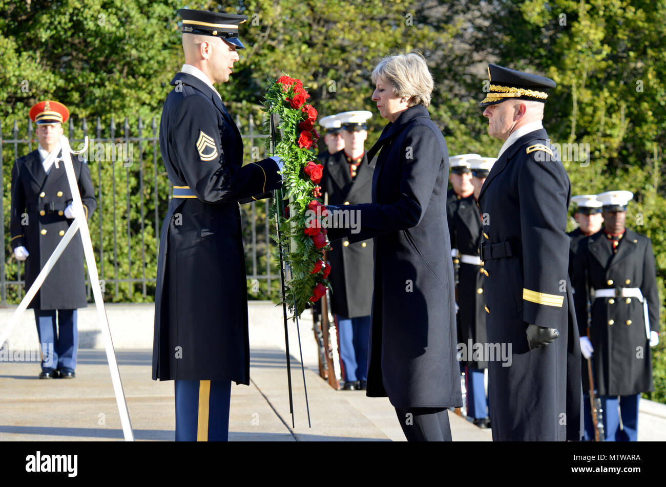 The Right Honorable Theresa May, Prime Minister of the United Kingdom, participated in an Armed Forces Full Honor wreath laying ceremony hosted by Maj. Gen. Bradley A. Becker, commanding general, Joint Force Headquarters-National Capital Region and The U.S. Army Military District of Washington, Jan. 27, 2017, at the Tomb of the Unknown Soldier, Arlington National Cemetery. The wreath laying is a part of the Prime Minister’s official visit to the United States. (U.S. Army photos by: Staff Sgt. Austin L. Thomas) Stock Photo