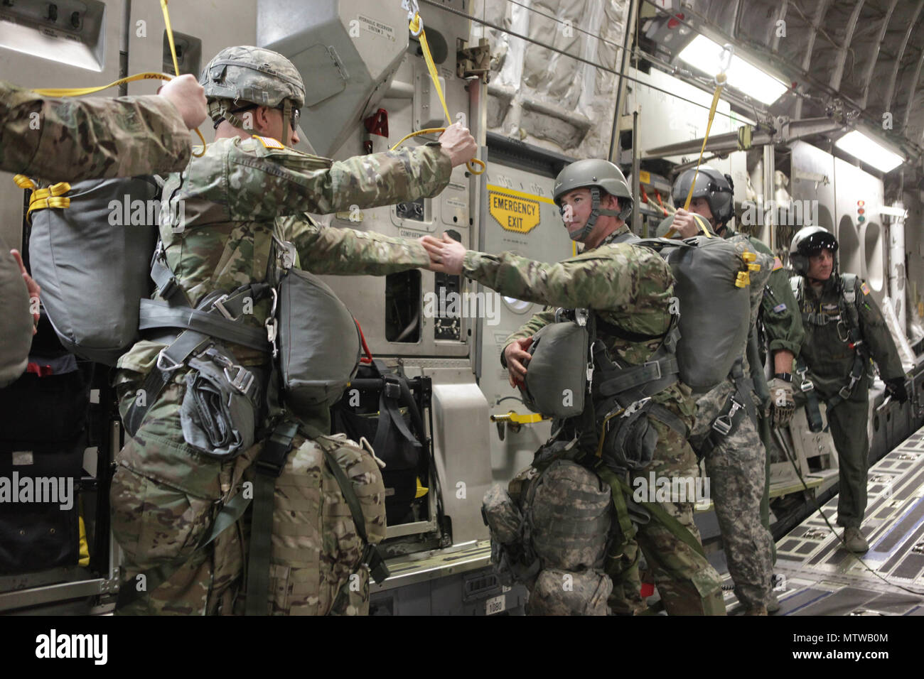 A U S Army Paratrooper Assigned To The 360th Civil Affairs Brigade Gives The All Ok Signal To The Jumpmaster For A Mass Tactical Airborne Jump For Operation Anvil In North Air Force Auxiliary