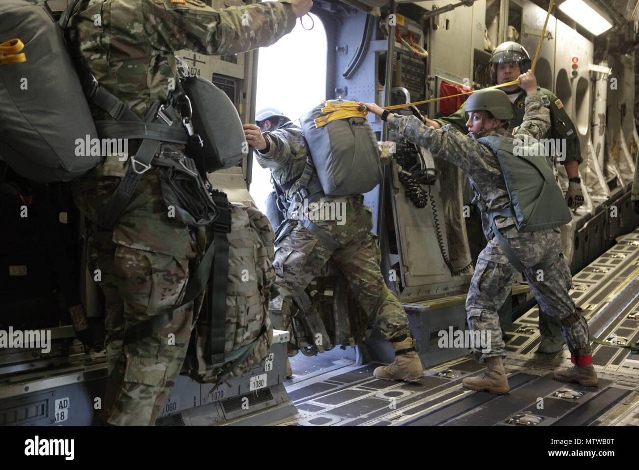 A U S Army Jumpmaster Assigned To The 360th Civil Affairs Brigade Inspects The Right Troop Door On A U S Air Force C 17 Globemaster For A Mass Tactical Airborne Jump For Operation Anvil