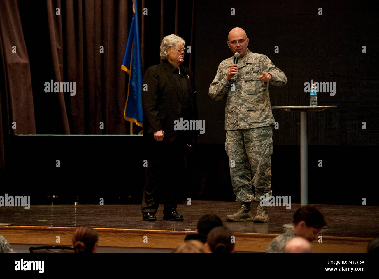 U.S. Air Force Chief Master Sgt. Alexander Del Valle, 51st Fighter Wing command chief, thanks Dave Roever, a Vietnam War veteran, for speaking about resiliency at Osan Air Base, Republic of Korea, Jan. 25, 2017. Roever, is an inspirational speaker who shares his story about how he survived after suffering burns all over his body when a phosphorus grenade exploded in his hand during the war. (U.S. Air Force photo by Staff Sgt. Jonathan Steffen) Stock Photo