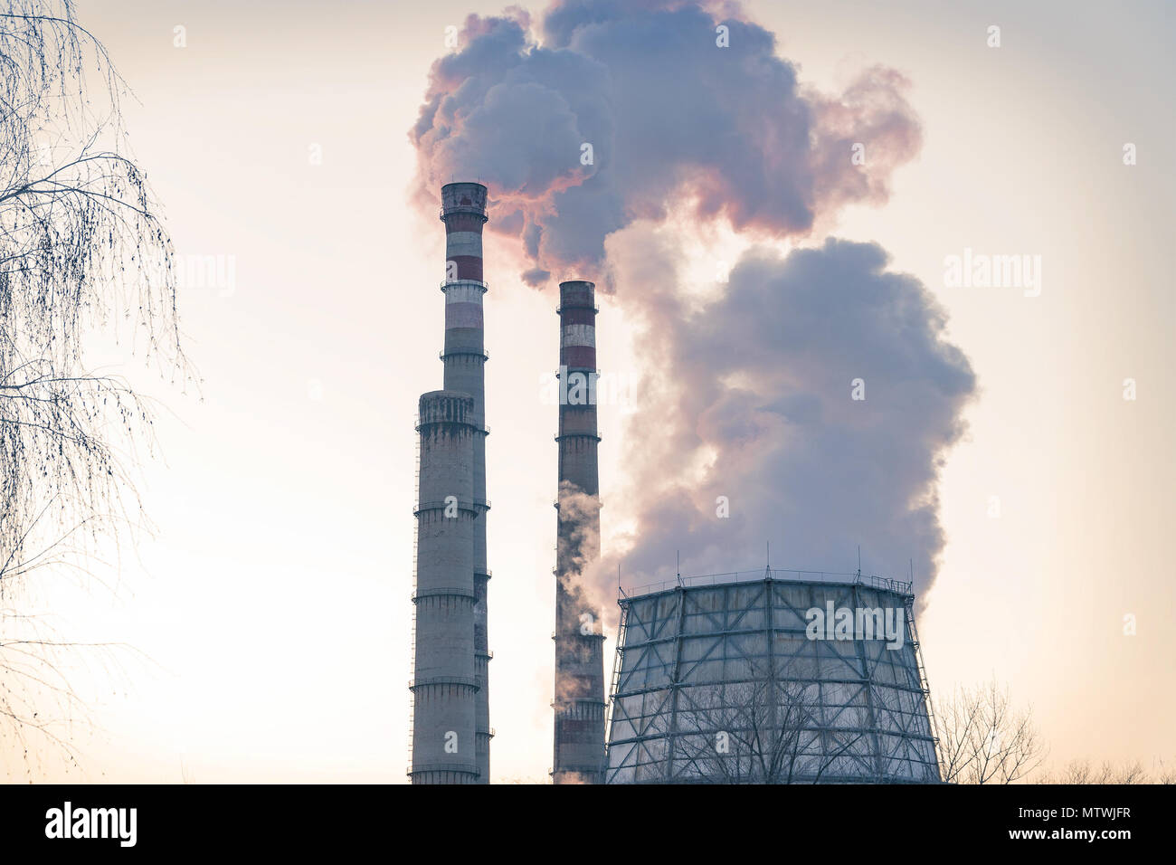 Smoke from factory pipes against the sky. Environmental pollution Stock Photo