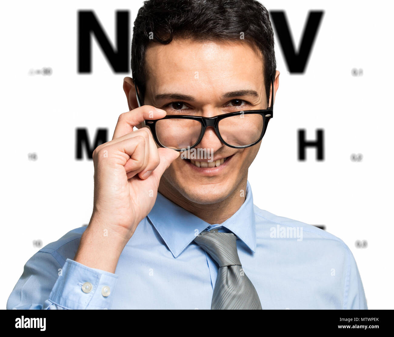 Man taking an eye exam and wearing glasses Stock Photo Alamy