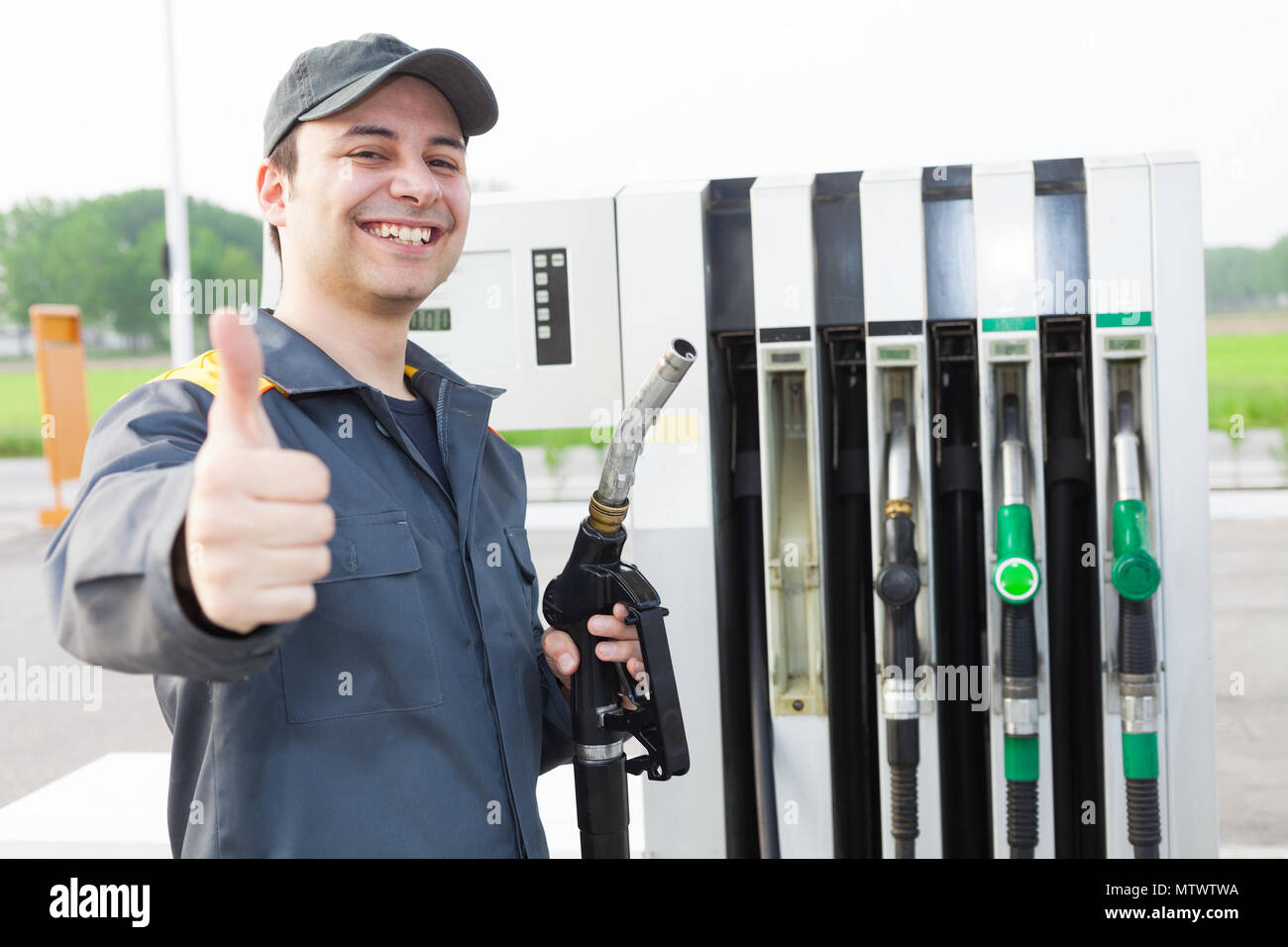 smiling-worker-at-the-gas-station-giving-thumbs-up-MTWTWA.jpg
