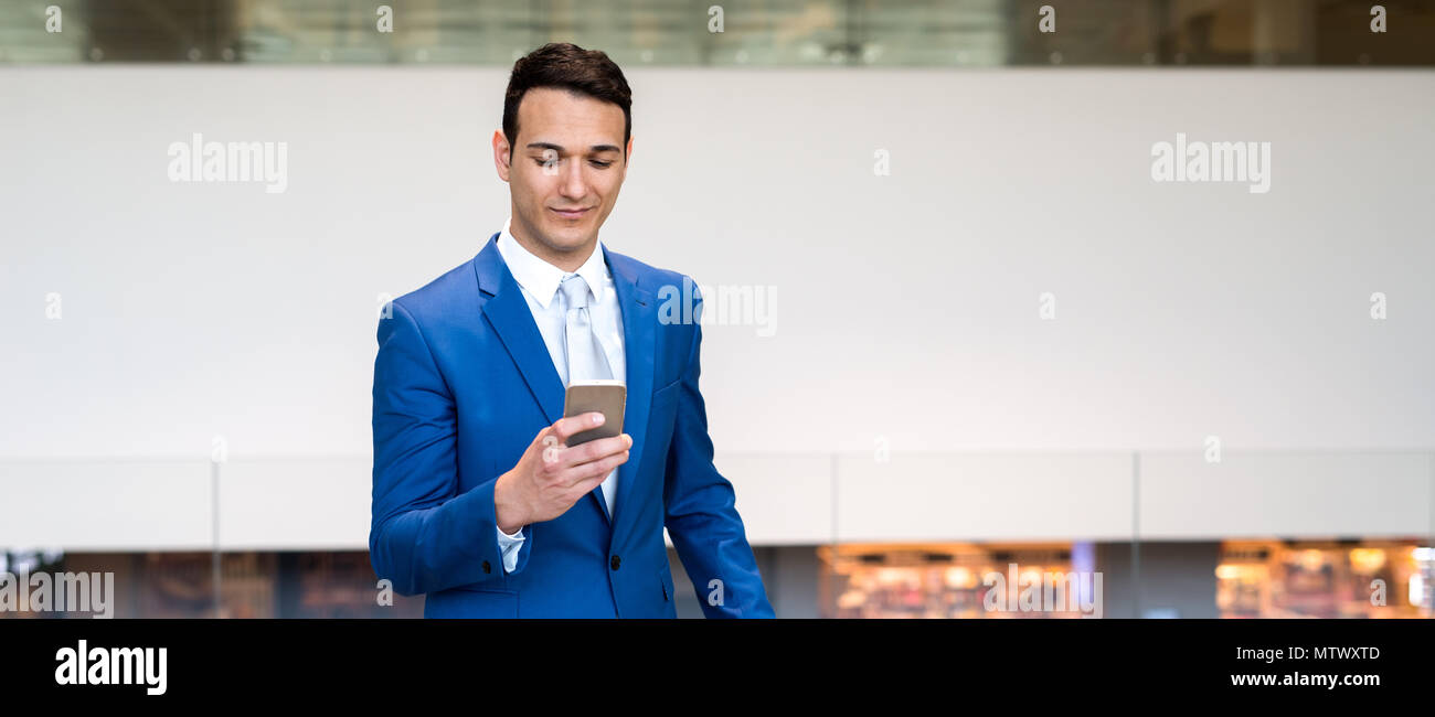Businessman using his cellphone Stock Photo