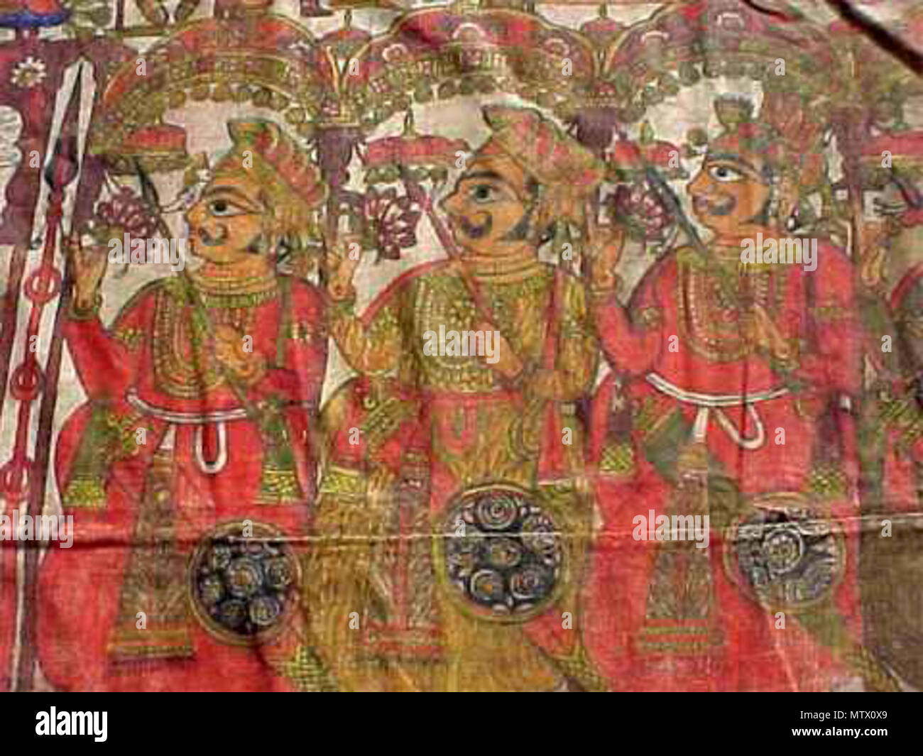 . English: A series of images of another par of Pabuji, this one from the early 19th century Source: ebay, April 2002 'This is an old (mid 1800s or earlier) Par. The painted textile is approximately 16 feet long and 55 1/2 inches wide. The story painting has been used to relay the story many times through the years and shows normal wear, especially on the bottom edge. There are some old repairs. The textile is made of two narrow pieces ( 26 3/4') sewen together. It appears to be an old linen-type material.' . early 19th century. Unknown 462 Pabuji2f Stock Photo