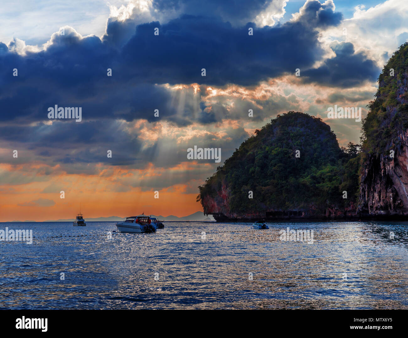 Popular travel tropical karst rocks perfect for climbing Phra Nang Cave Beach in sunset, Krabi province, Thailand Stock Photo