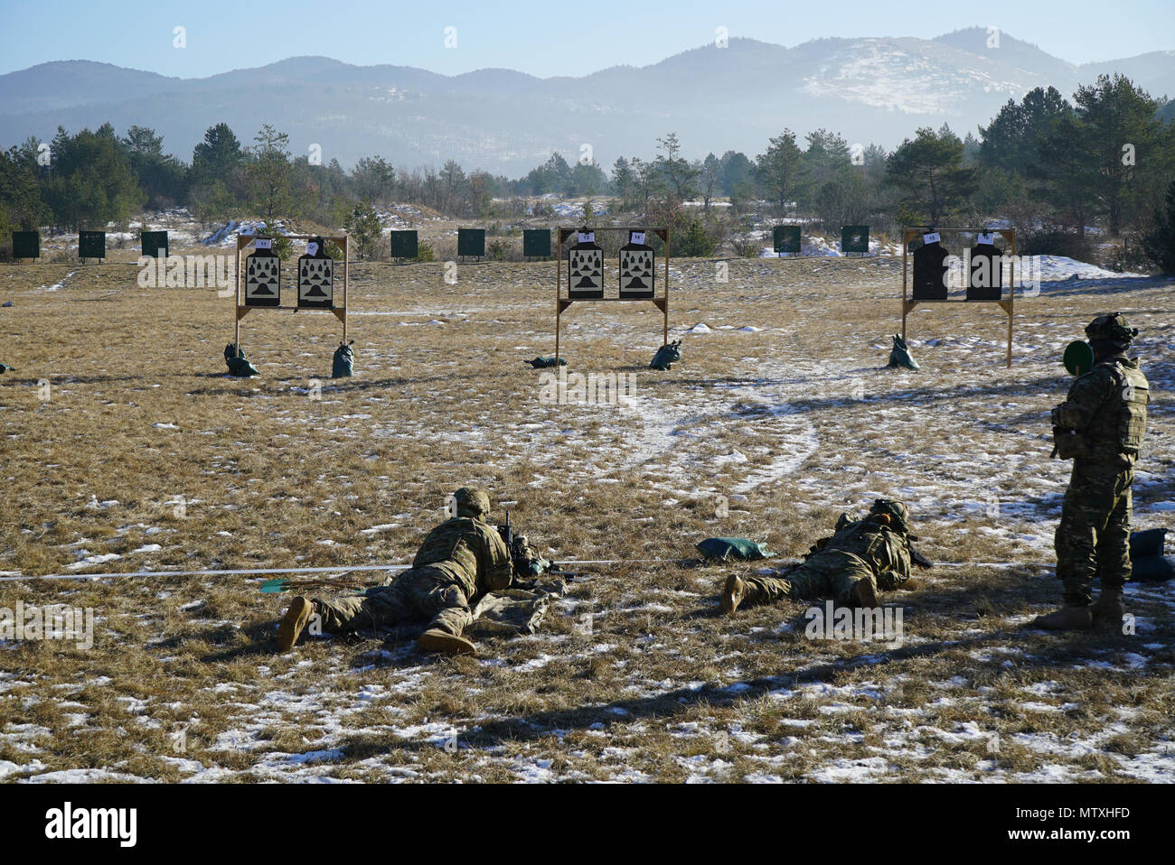 U.S. Army paratroopers from the 173rd Brigade Support Battalion, 173rd Airborne Brigade conduct M4 carbine weapons qualification during exercise Lipizzaner III in Bac, Slovenia, on Jan. 24, 2017. Lipizzaner is a combined squad-level training exercise in preparation for platoon evaluation, and to validate battalion-level deployment procedures.(Photo by Visual Information Specialist Massimo Bovo/released) Stock Photo
