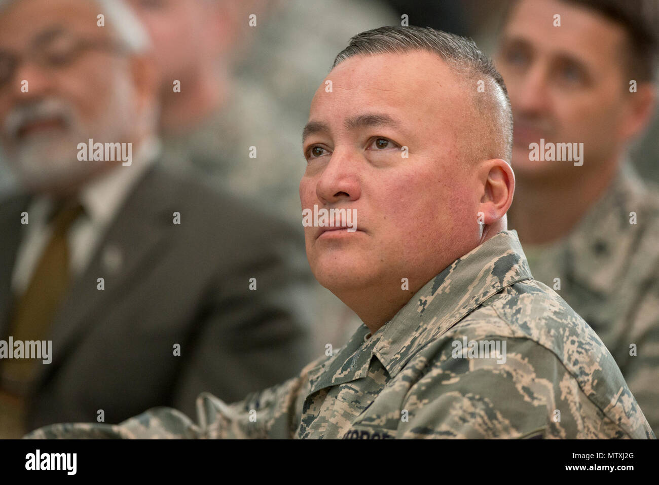 Chief Master Sergeant Mitchell O. Brush, senior enlisted advisor to the Chief of the National Guard Bureau, listens during a town hall forum at the Air National Guard Readiness Center at Joint Base Andrews 31, January 2017. The forum was hosted by the Chief of the National Guard Bureau, Air Force General Joseph L. Lengyel, who discussed the role the ANG, the National Guard’s role as a member of the Joint Chiefs of Staff and his priorities while serving as CNGB. (U.S. Air National Guard photo by Master Sgt. Marvin Preston) Stock Photo