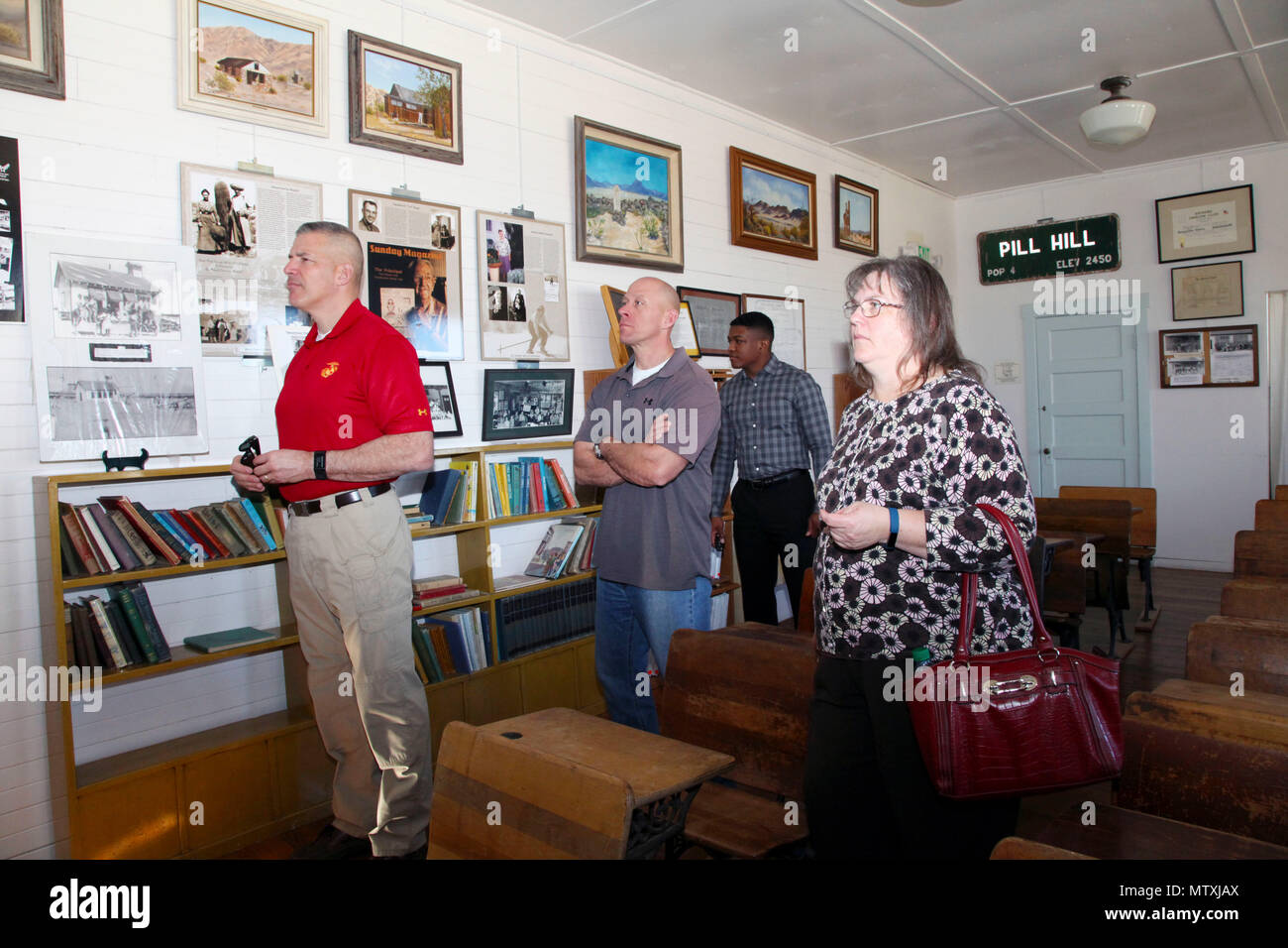 Brig. Gen. William F. Mullen III, Combat Center Commanding General, left; Sgt. Maj. Michael J. Hendges, Combat Center Sergeant Major; Cpl. Ben Mills, driver; and Vicki Mullen listen to Twentynine Palms Historical Society volunteer Pat Rimmington during a tour of the Old Schoolhouse Museum in Twentynine Palms, Calif., Jan. 31, 2017. The four toured the facility with Jim Ricker, Combat Center Assistant Chief of Staff for Government and External Affairs; and Kristina Becker, Combat Center External Affairs Director. (Official Marine Corps photo by Kelly O'Sullivan/Released) Stock Photo