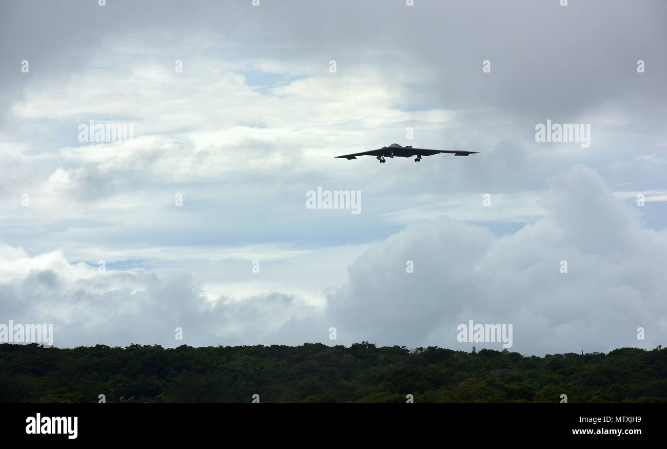 A U.S. Air Force B-2 Spirit deployed from Whiteman Air Force Base, Mo., prepares to land after conducting a local training mission at Andersen Air Force Base, Guam, Jan. 11, 2017. Bomber missions familiarize aircrew with airbases and operations in different Geographic Combatant Commands. (U.S. Air Force photo by Airman 1st Class Jazmin Smith) Stock Photo