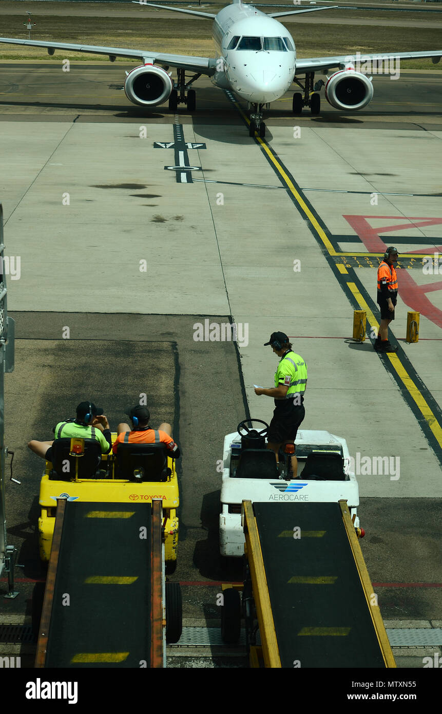 passenger jet, Airport baggage handlers Stock Photo