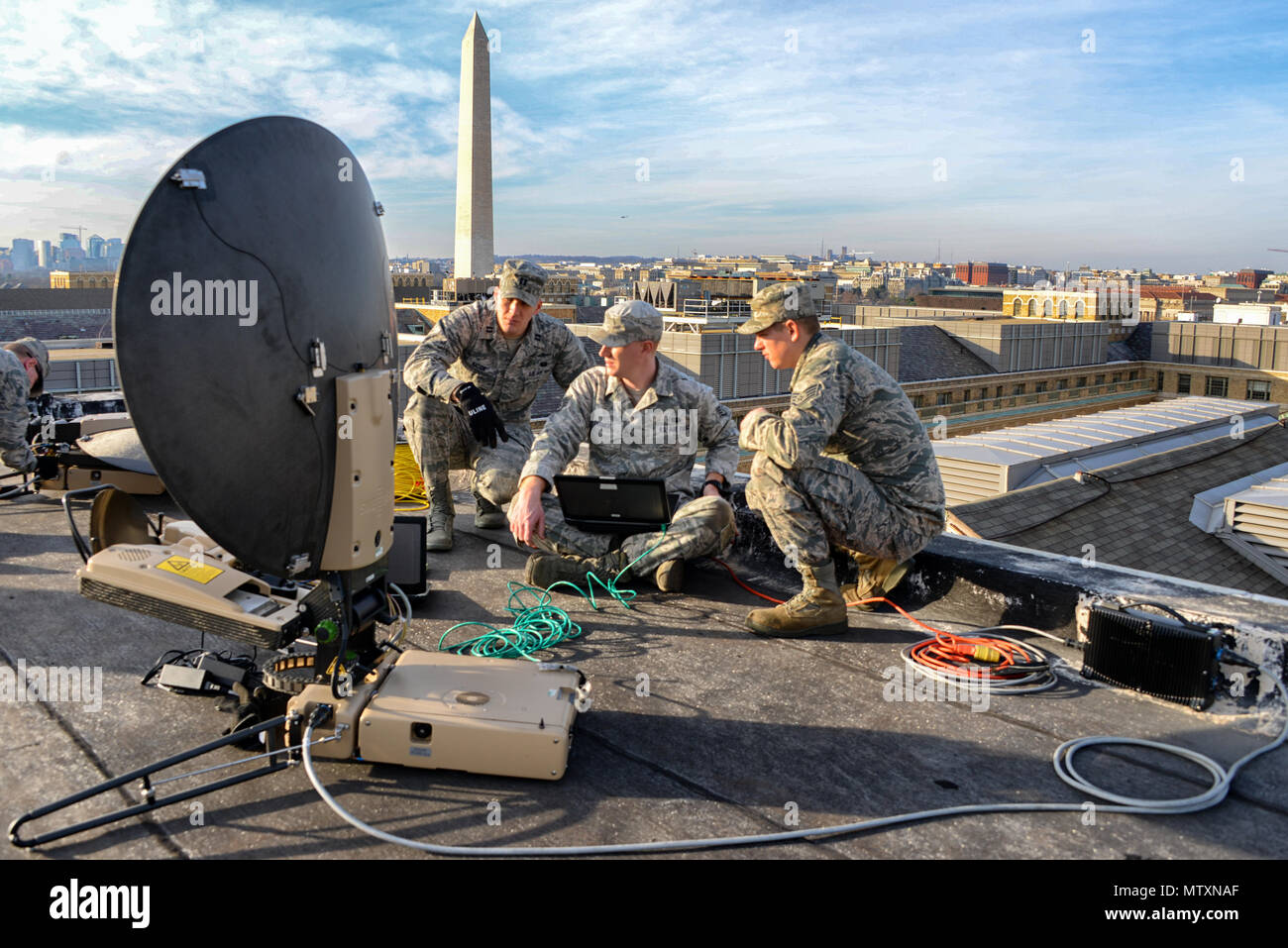 WASHINGTON -Members of the 119th Command and Control Squadron with the Tenn.  National Guard, set up a parabolic dish on a downtown rooftop to provide  satellite communications between supported agencies during the