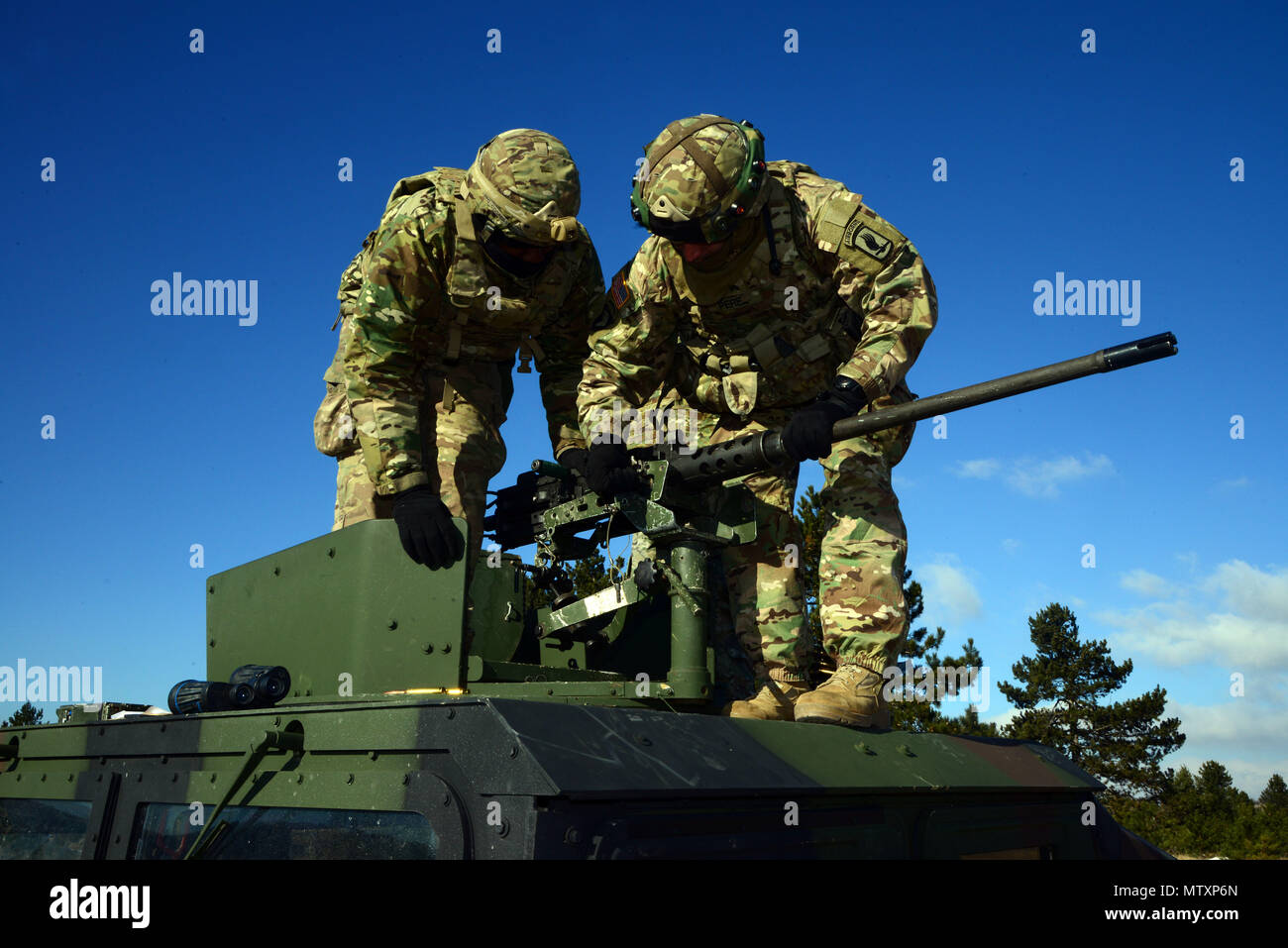 U.S. Army paratroopers from the 173rd Brigade Support Battalion, 173rd Airborne Brigade prepare to qualify .50-caliber machine gun during Exercise Lipizzaner III in Bac, Slovenia, on Jan. 25, 2017. Lipizzaner is a combined squad-level training exercise in preparation for platoon evaluation, and to validate battalion-level deployment procedures. (U.S. Army photo by Visual Information Specialist Massimo Bovo/Released) Stock Photo