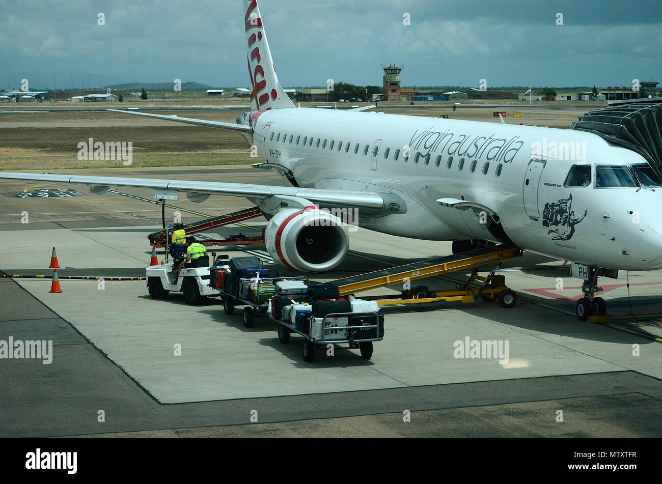 Luggage being loaded into passenger jet Stock Photo