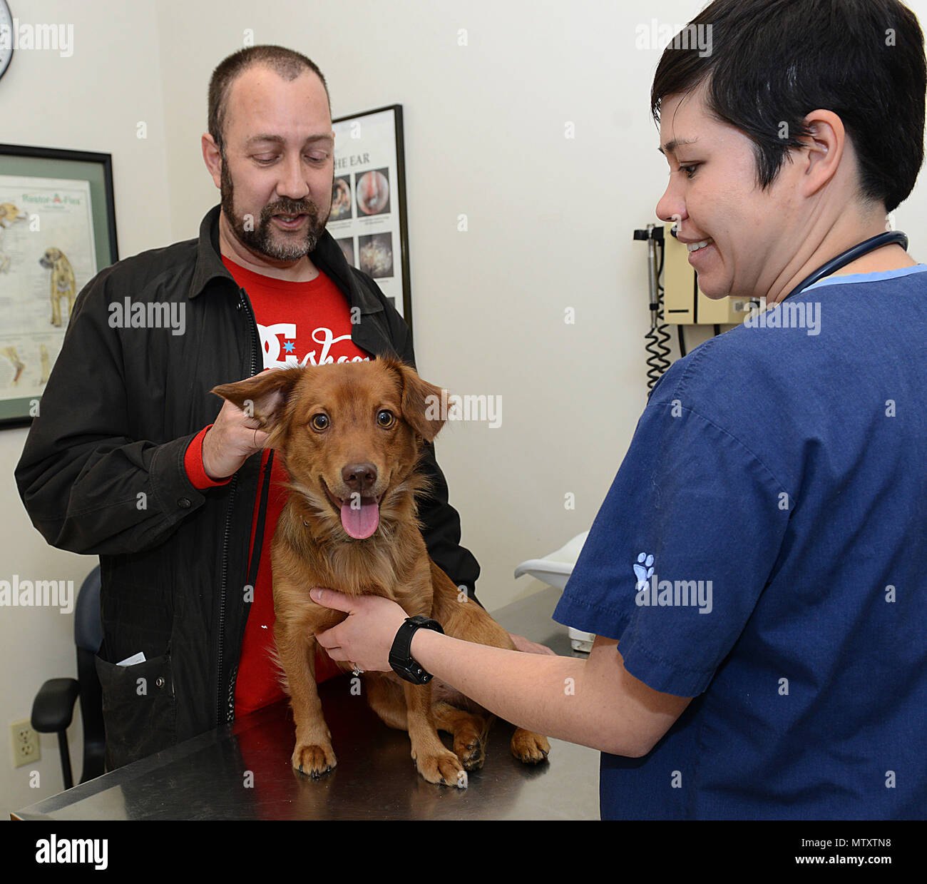 U.S. Army Capt. Emily Stuebing, Fort Eustis Veterinary Clinic veterinarian, speaks with retired