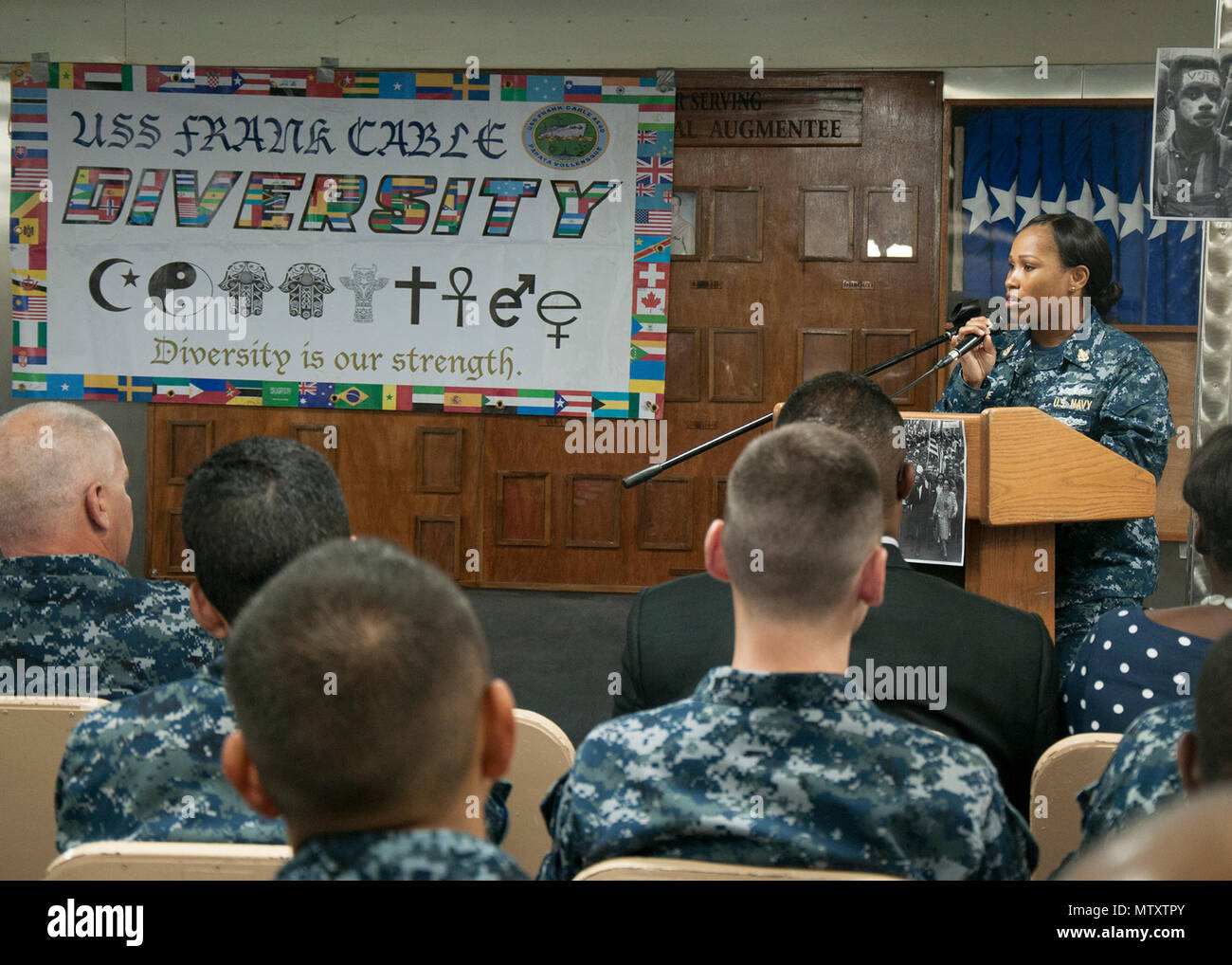 170131-N-DS883-036    SANTA RITA, Guam (Jan. 31, 2017) Senior Chief Electronics Technician LaToya Blaine, a Sailor assigned to the submarine tender USS Frank Cable (AS 40), speaks during a ceremony honoring Dr. Martin Luther King Jr. aboard the ship, January 31. The ship’s diversity committee held the event to reenact the1965 Selma-to-Montgomery March for voting rights led by Martin Luther King Jr.’s Southern Christian Leadership Conference. (U.S. Navy photo by Mass Communication Specialist Seaman Heather C. Wamsley/Released) Stock Photo