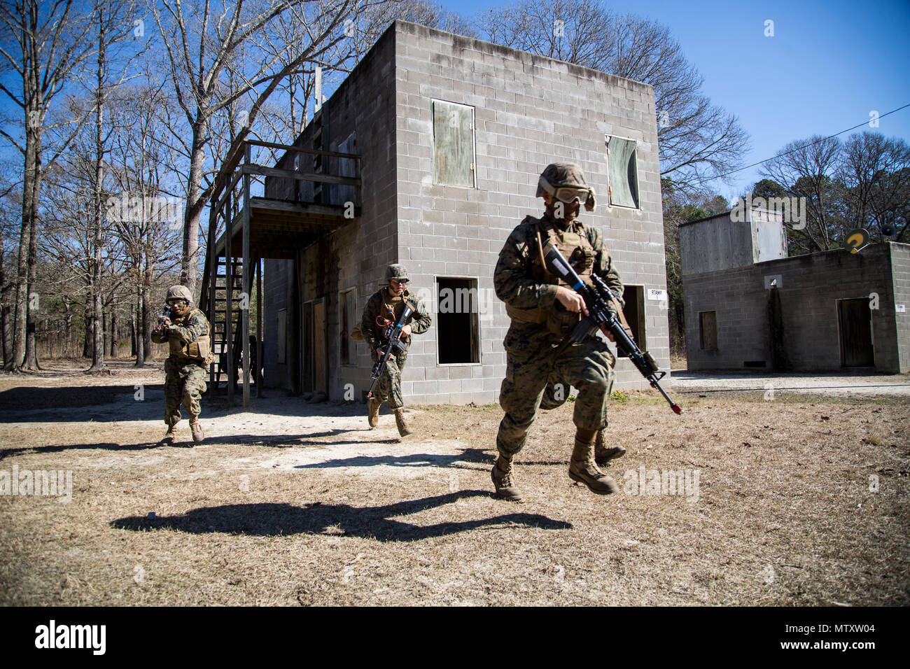 U.S. Marines with Company F (Fox Co.), Marine Combat Training Battalion (MCT), School of Infantry-East conduct Military Operations in Urban Terrain during their Basic Skills Readiness Exercise (BSRE) aboard Camp Geiger, N.C., Jan. 31, 2017. U.S. Marines attending MCT go through BSRE, a 24 hour evaluation testing them in all the skills that they have learned while in training. (U.S. Marine Corps photo by Lance Cpl. Jose Villalobosrocha) Stock Photo