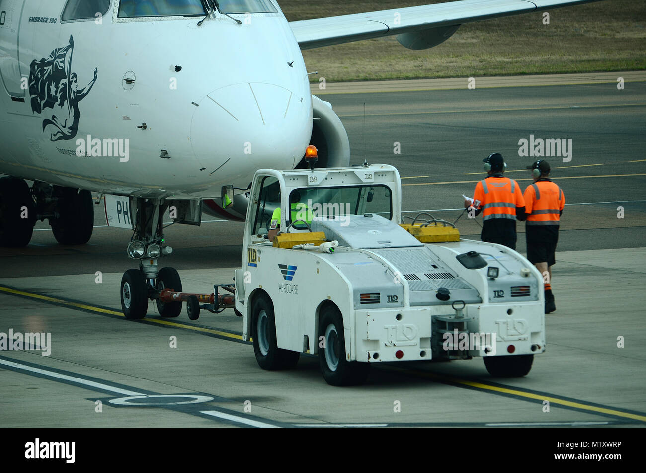 passenger jet, aircraft taxiing, pushing back Stock Photo