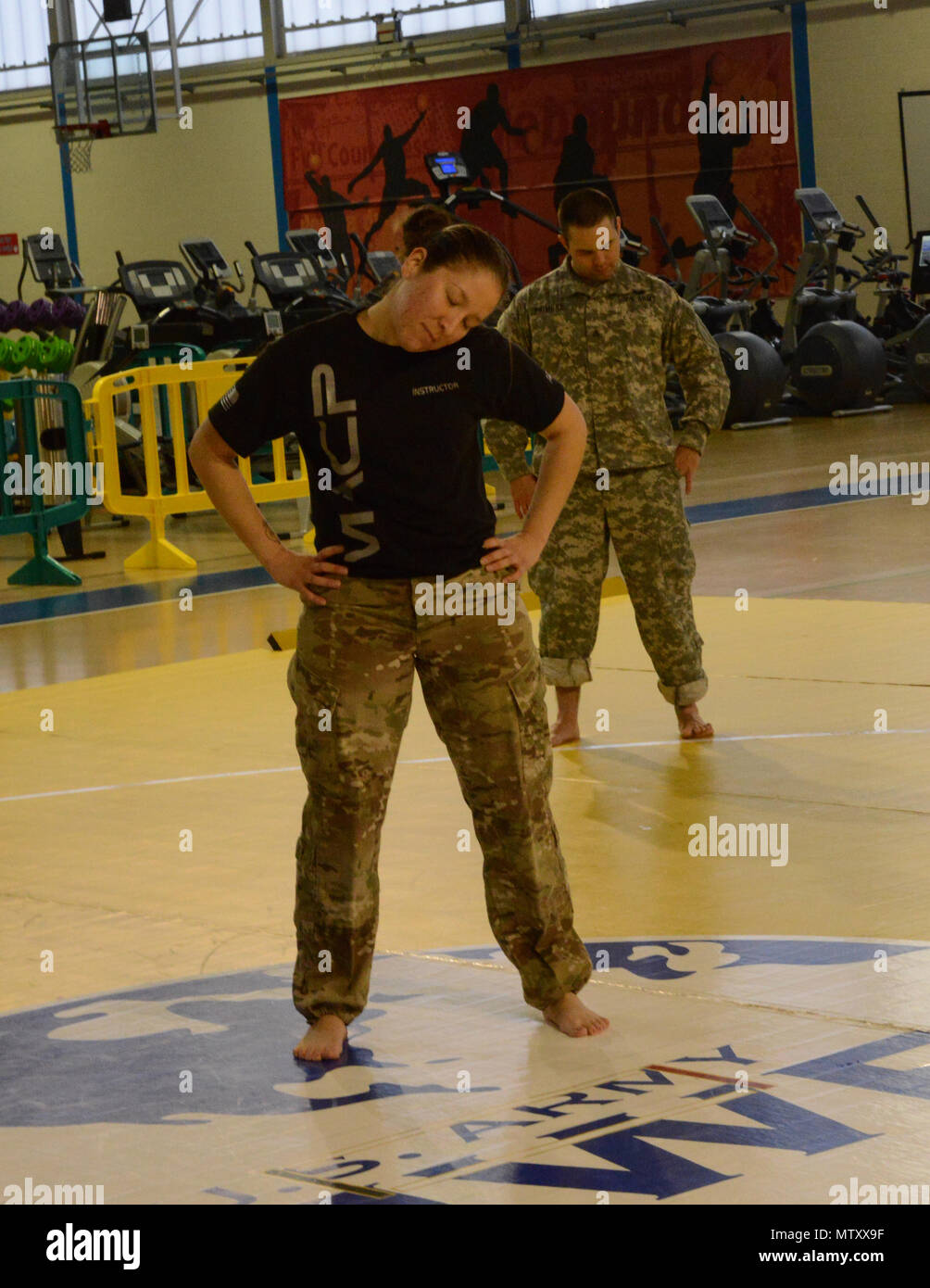 U.S. Army, Sgt. Maria Acuna, AFNORTH shows warm up exercises to U.S