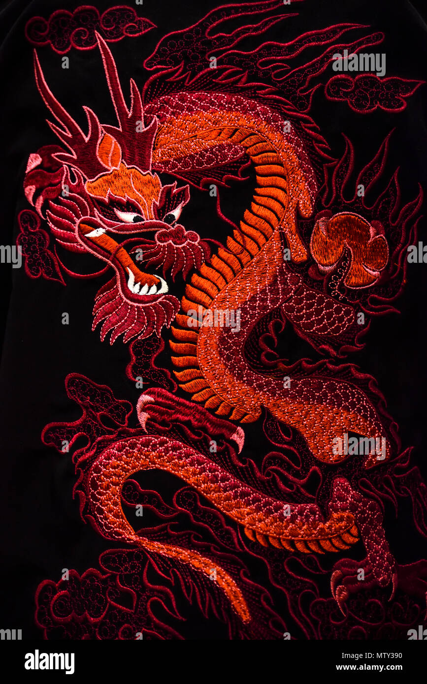 Red dragon on a black background, traditional symbol of China Stock Photo