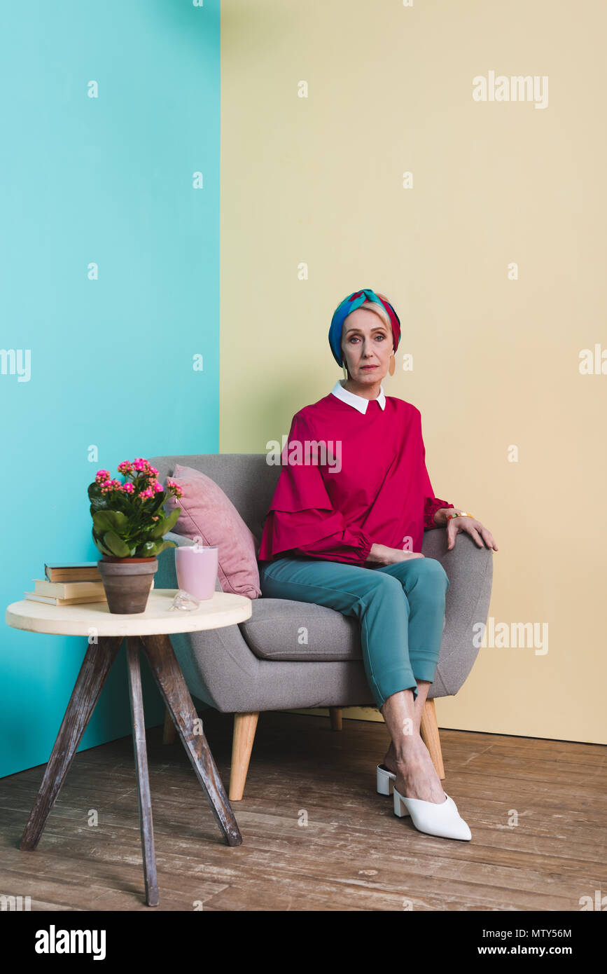 sitting in armchair