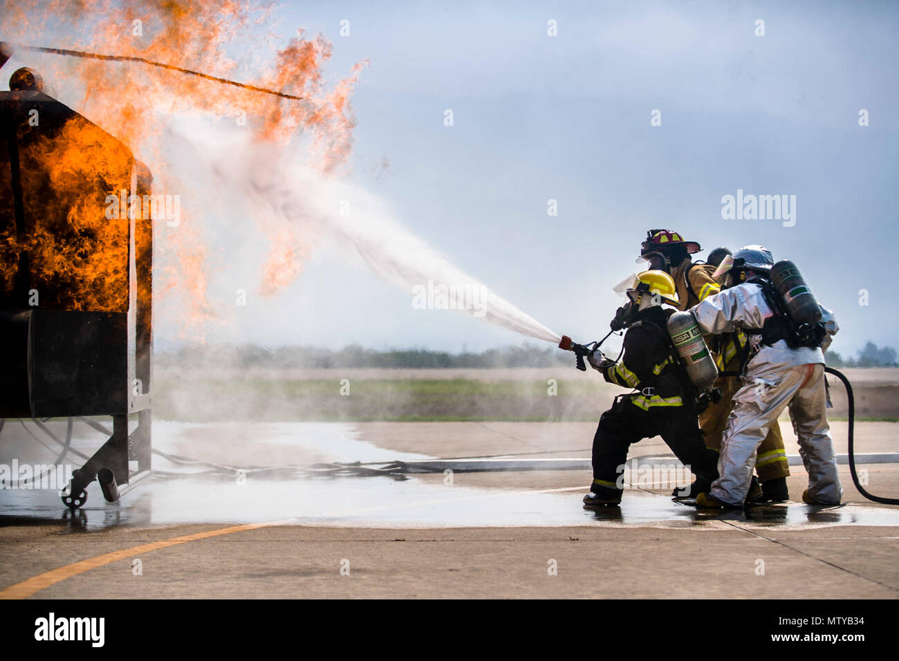 Firefighters from Central America learn new fire hose techniques at a ...
