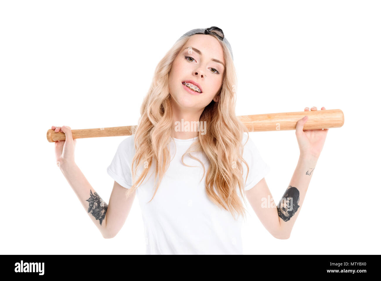 Half-length shot of a young woman holding a baseball bat behind her  shoulders Stock Photo - Alamy