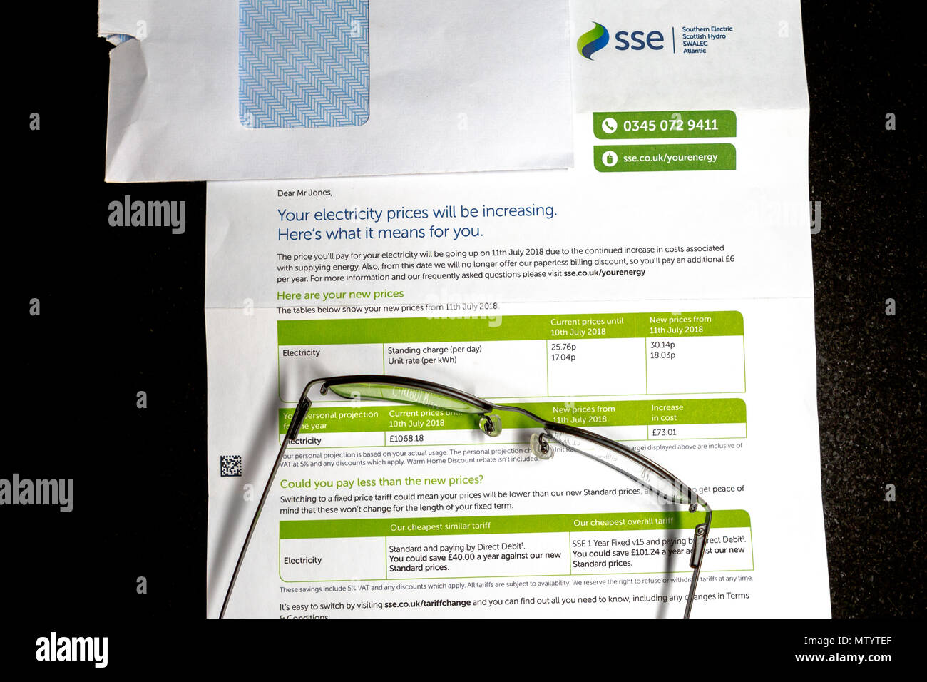 A notification of an electricity price increase to take effect from 11th July 2018 arrived today for an SSE customer. Notifying not only an increase in electricity prices but also an additional cost of £6 per year, due to them no longer offering a paperless billing discount. With an increase of 4.38p for the standing charge per day and an increase of 0.99p on the unit rate (per Kwh). Giving this customer an increased projection cost of £73.01 for next year. © Ian Jones/Alamy Live News. Stock Photo