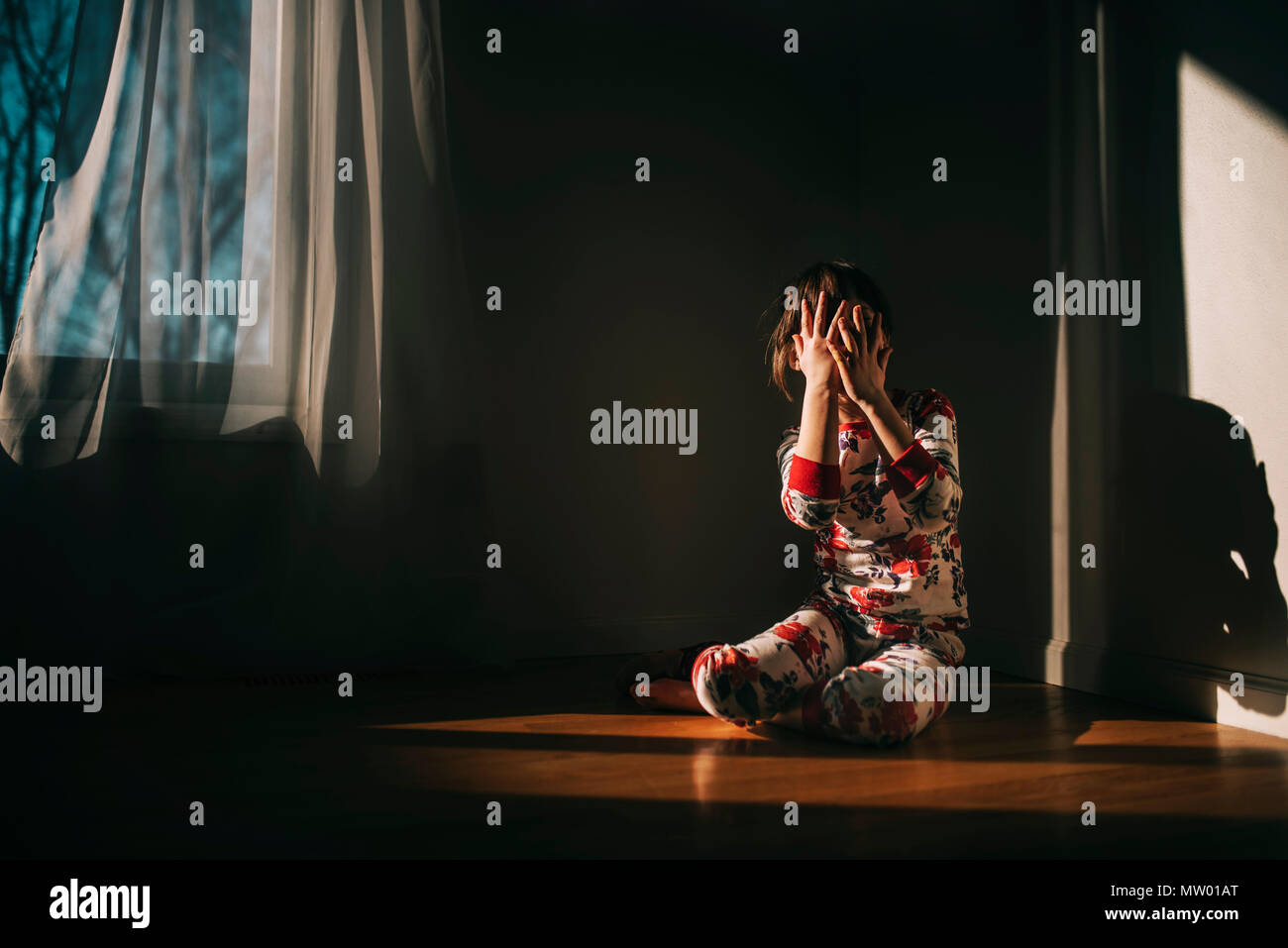 Girl sitting on hands hi-res stock photography and images - Alamy