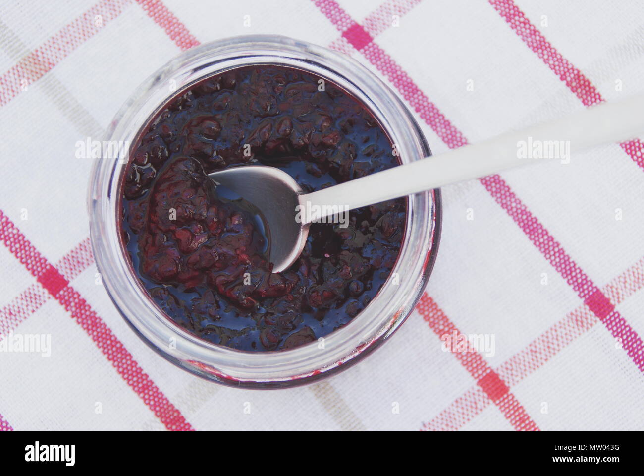 Spoon and Glass pot of jam Stock Photo Alamy