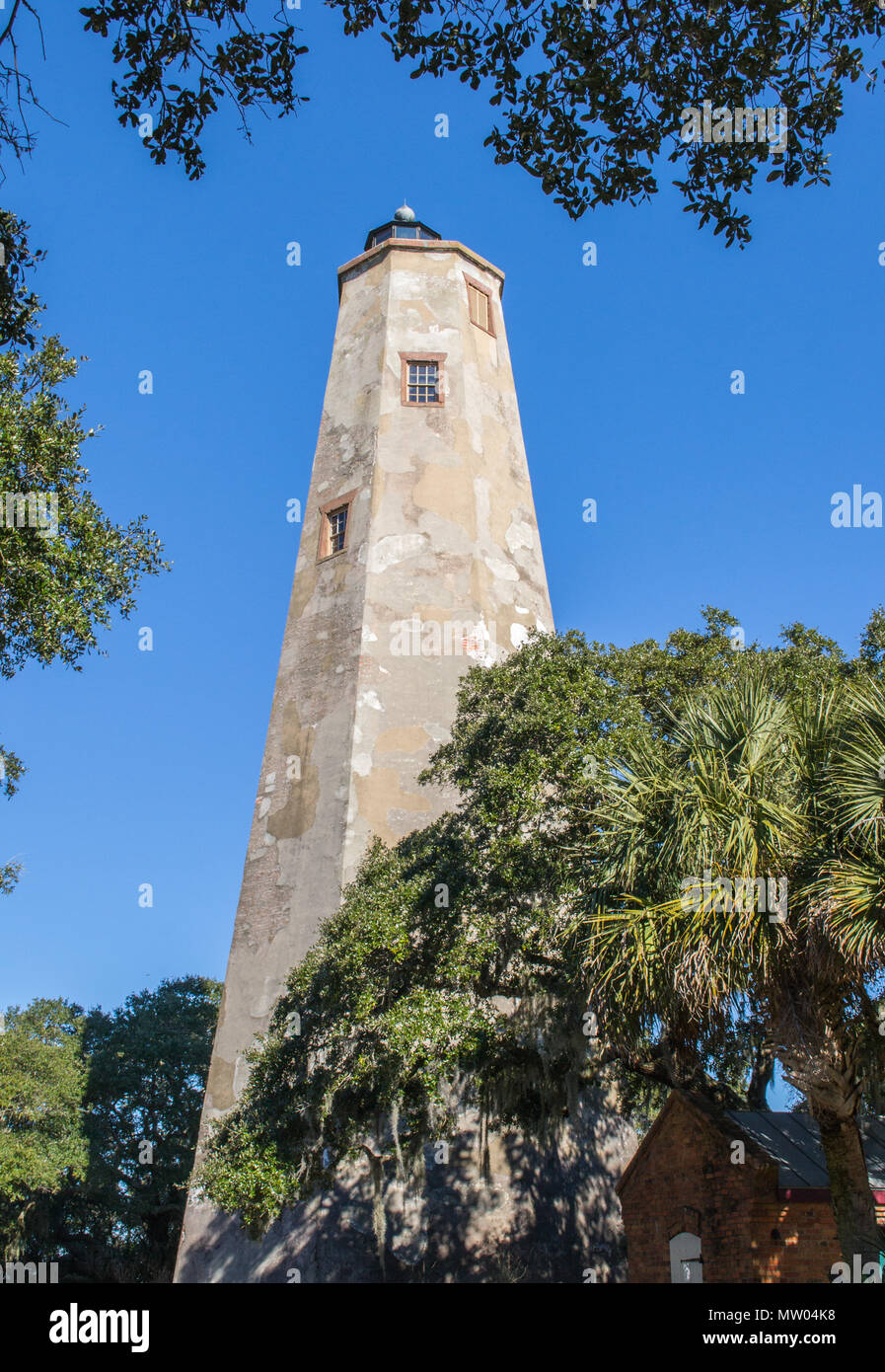 Bald Head Island North Carolina travel vacation getaway at the beach. Visit the historic lighthouse, search for seashells on the beach, enjoy ecology. Stock Photo