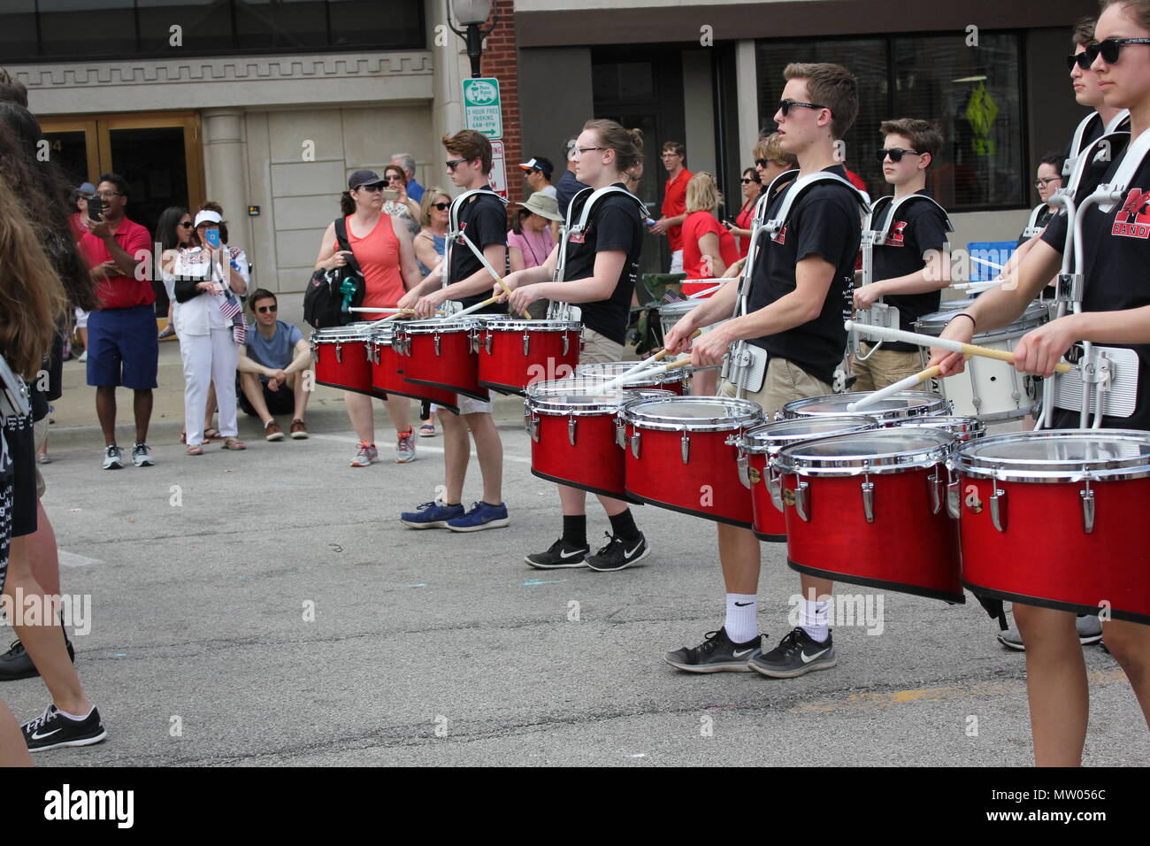 Memorial Day Parade high school band drum section marching thru the
