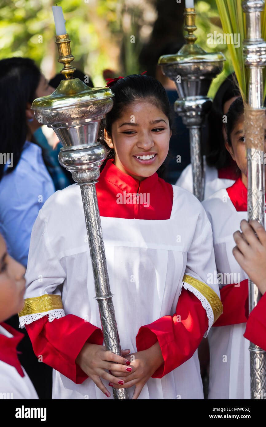 A young girl carries a candle holder in the PALM SUNDAY procession from  Parque Juarez to the Jardin - SAN MIGUEL DE ALLENDE, MEXICO Stock Photo -  Alamy